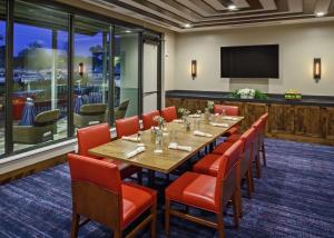 a conference room with a long table and chairs at The Bevy Hotel Boerne, A Doubletree By Hilton in Boerne