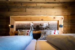 Voodi või voodid majutusasutuse Almgasthaus Glocknerblick toas