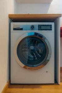 a washing machine is in a room at Eco-Luxe Retreat in Ano Petali, Sifnos in Apollonia