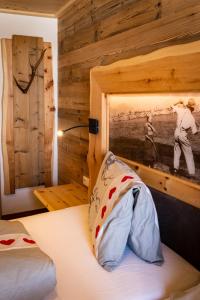Voodi või voodid majutusasutuse Almgasthaus Glocknerblick toas