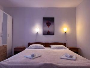 Postel nebo postele na pokoji v ubytování Apartment Toni Privlačka 32