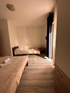 Postel nebo postele na pokoji v ubytování Apartment Toni Privlačka 32