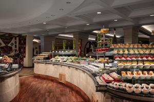 a buffet line with many different types of food at Palm Royale Resort - Soma Bay in Hurghada