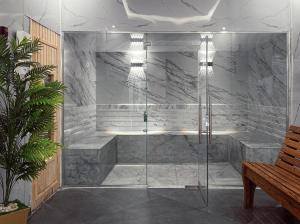 a shower with a glass door in a bathroom at Palm Royale Resort - Soma Bay in Hurghada