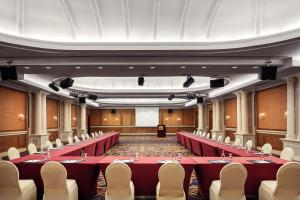 a large room with red tables and chairs at Palm Royale Resort - Soma Bay in Hurghada