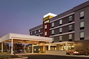 a rendering of a hotel with a gas station at Home2 Suites By Hilton Portland Airport in Portland