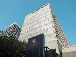 a tall building with a sign in front of it at DoubleTree by Hilton Newark Penn Station, NJ in Newark