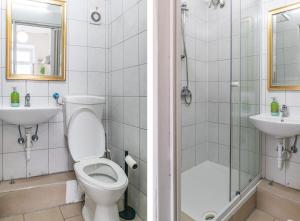 a bathroom with a toilet and a sink at Budget Apartments Well connected to the Whole City in Vienna