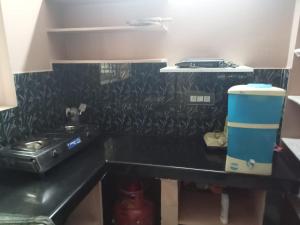 Η κουζίνα ή μικρή κουζίνα στο Comfort Abode Homestay