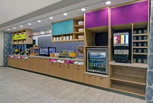 a grocery store with a cashier counter in a store at Home2 Suites By Hilton Memphis Wolfchase Galleria in Memphis