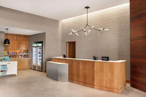 a kitchen with a counter and a counter top at Homewood Suites By Hilton Wilmington Downtown in Wilmington