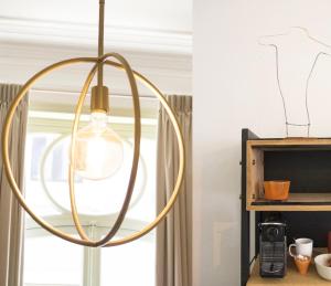 a orb light fixture in a kitchen next to a window at Wok Rooms in Brussels