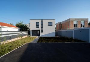 a house with a driveway in front of it at Villa Zulfikar in Mostar