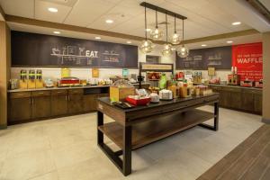 a fast food restaurant with a counter with food at Hampton Inn & Suites Kutztown, Pa in Kutztown