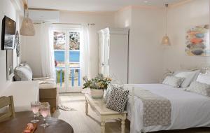Cama ou camas em um quarto em Erato Hotel Mykonos