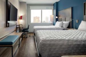 Tru By Hilton Denver Downtown Convention Center客房内的一张或多张床位