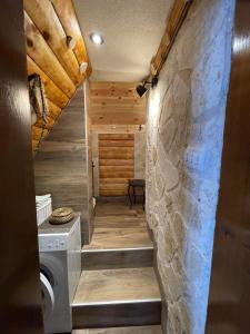 a bathroom with a washer and dryer in a house at NV Mountain House in Žabljak