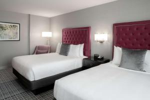 A bed or beds in a room at The Axis Moline Hotel, Tapestry Collection By Hilton