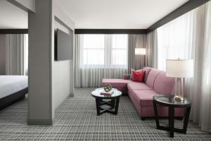 A bed or beds in a room at The Axis Moline Hotel, Tapestry Collection By Hilton
