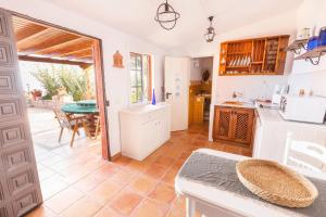 a kitchen and living room with a table and a table at Mountain Getaway for Hikers 2 in Arafo