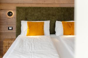 Postel nebo postele na pokoji v ubytování Suàn Hotel