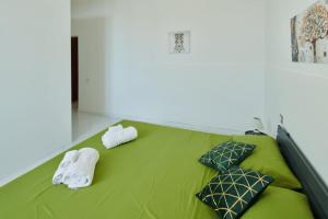 Ένα ή περισσότερα κρεβάτια σε δωμάτιο στο [Gioiello a due passi da Ortigia]private parking