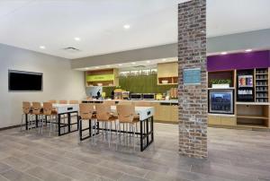 a lobby of a hospital with chairs and a counter at Home2 Suites By Hilton Charleston Daniel Island, Sc in Charleston
