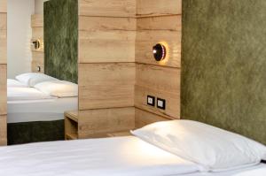 Postel nebo postele na pokoji v ubytování Suàn Hotel