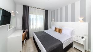 Кровать или кровати в номере Motto Premium Hotel&Spa