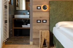 Postel nebo postele na pokoji v ubytování Suàn Hotel