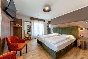 TV a/nebo společenská místnost v ubytování Suàn Hotel