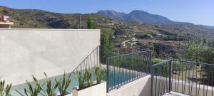 a balcony with a view of the mountains at Casa Rural Reserva de las Nieves in Tolox