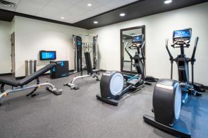 a gym with several treadmills and cardio machines at Home2 Suites By Hilton Minneapolis-Mall of America in Bloomington