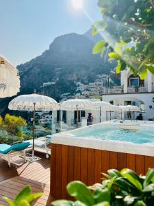 a swimming pool with a view of a mountain at Villa Dei Principi in Positano