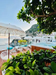 a resort with a pool and a view of the ocean at Villa Dei Principi in Positano