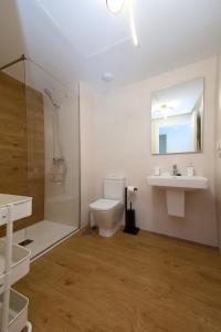 a bathroom with a toilet and a sink and a shower at THE SEA VIEW CALACEITE in Torrox Costa