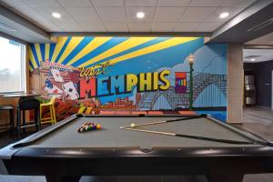 a pool table in a room with a mural at Tru By Hilton West Memphis, Ar in West Memphis