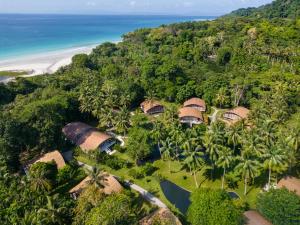 an aerial view of a resort with palm trees and the ocean at Taj Exotica Resort & Spa, Andamans in Havelock Island