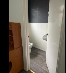 a bathroom with a toilet and a sink at Mac studio : private room, en-suite & own access in Belfast