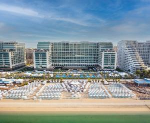 a view of a city with a beach and buildings at Hilton Dubai Palm Jumeirah in Dubai