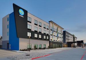 a building with a ups sign on the side of it at Home2 Suites By Hilton Euless Dfw West, Tx in Euless