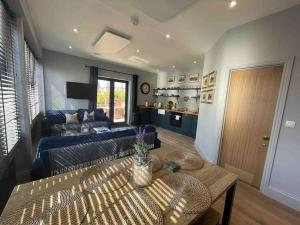 a living room with a couch and a table at The Carriage House in Salisbury
