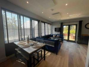 a living room with a table and a couch at The Carriage House in Salisbury