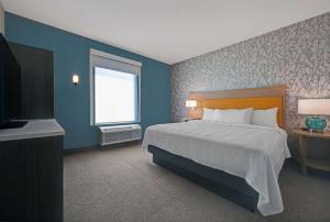 Home2 Suites By Hilton Tracy, Ca客房内的一张或多张床位