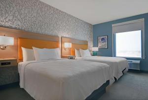 Home2 Suites By Hilton Tracy, Ca客房内的一张或多张床位