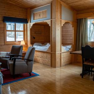 a room with a desk and chairs in a cabin at Gargia Lodge in Alta