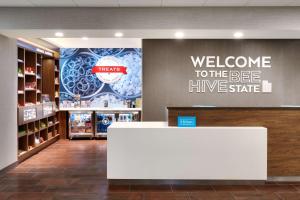 a welcome to the bee hive state sign in a store at Hampton Inn & Suites Spanish Fork, Ut in Spanish Fork