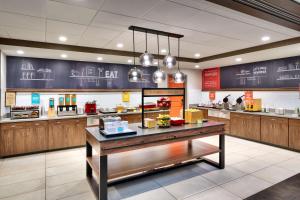 a fast food restaurant with a counter with food at Hampton Inn & Suites Spanish Fork, Ut in Spanish Fork