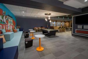 a gaming room with a pool table and ping pong ball at Tru By Hilton Grove City Columbus in Grove City