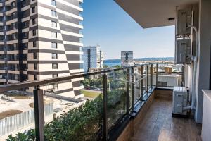 an apartment balcony with a view of a city at Metalex Garden 2bdrm Luxury Apartment in Varna City